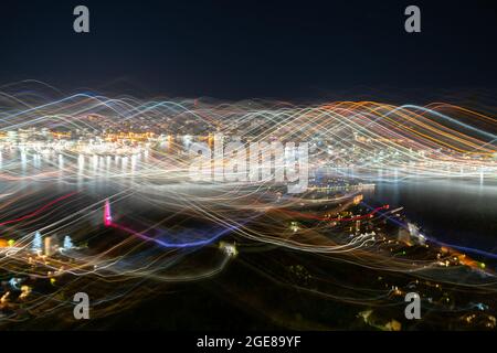 Abstract effect Wellington city urban bright night lights across city with wave and color pattern shot using long exposure and intentional camera move Stock Photo