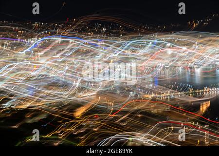 Abstract effect Wellington city urban bright night lights across city with wave and color pattern shot using long exposure and intentional camera move Stock Photo