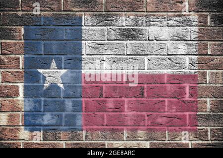 Texas state flag on brick wall background Stock Photo