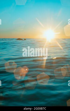 Sun rising over the water at Mollymook Beach. Stock Photo
