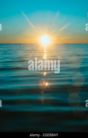 Sun rising over the water at Mollymook Beach. Stock Photo
