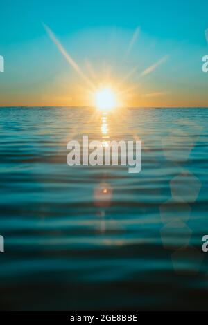 Sun rising over the water at Mollymook Beach. Stock Photo