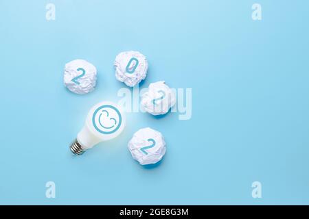 Idea and creative in 2022, lighting bulb with new year number on blue background Stock Photo