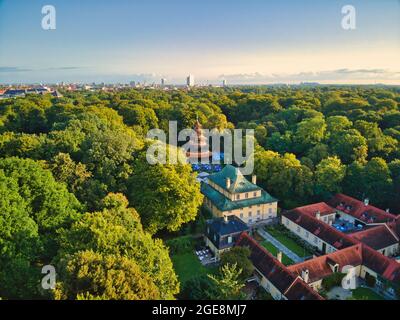 MUNICH, GERMANY - Aug 17, 2021: Aerial view of chinese tower in english garden munich. Historic building is a popular beer garden in central park of b Stock Photo