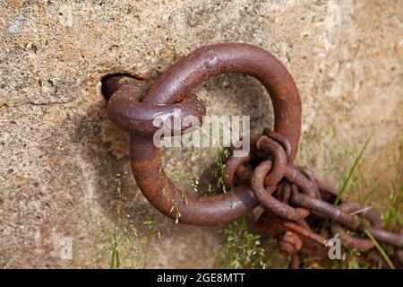 rusty metal ring that is for mooring boats Stock Photo