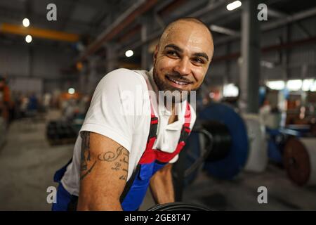 Portrait of a smiling handsome african american factory worker Stock Photo
