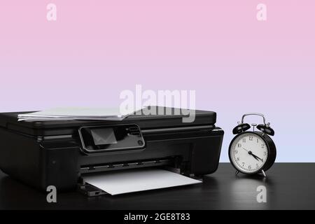 Compact home laser printer against pink background Stock Photo