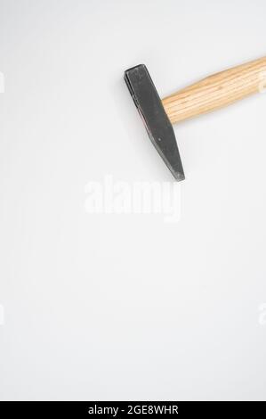 Machinist hammer with a wooden handle isolated on a white background- free space for text Stock Photo