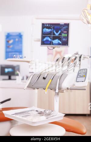 Professional stomatology dentistry bright hospital office room with nobody in it having medical orthodontics tooth instruments. Orthodontic cabinet with dental tools prepared for teethcare health Stock Photo