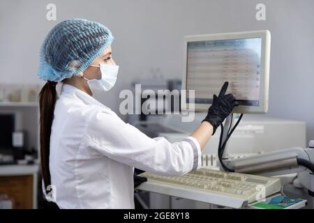 Scientist Working in Laboratory Using computer Screen Stock Photo