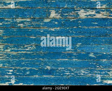 Color-Peel wood texture. Old wooden painted light blue rustic fence, paint peeling background Stock Photo