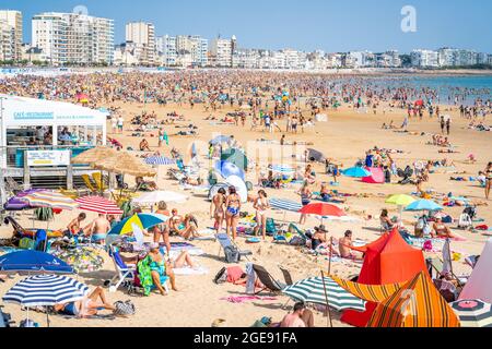 12 August 2021 , Les Sables d’Olonne France : View of La Grande Plage beach of Les Sables d’Olonne crowded with people during summer 2021 on France At Stock Photo