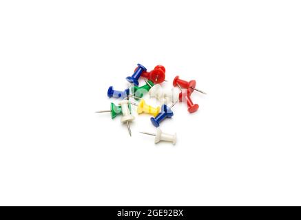 Colorful paper push pins on white background Stock Photo