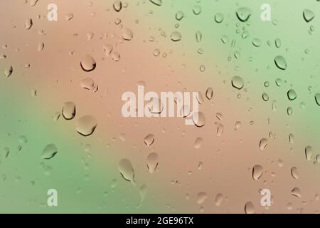 Abstract of colored drops on the glass with colored background Stock Photo