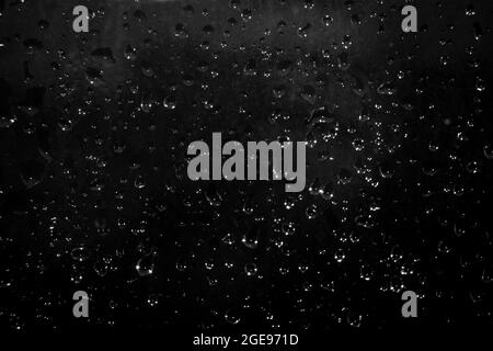 drops of water on dark glass. Abstract background Stock Photo