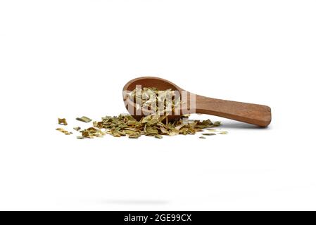 Dry chopped leeks in a wooden spoon isolated on white background. Stock Photo