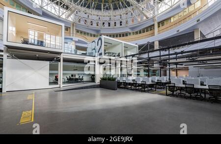 Big office with covered computers, closed due to quarantine Stock Photo