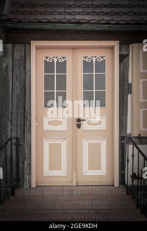 Front door and stairs of old house Stock Photo
