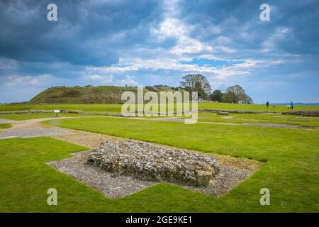 Old Sarum with the foundations of the cathedral in the foreground and the Norman motte behind. Stock Photo