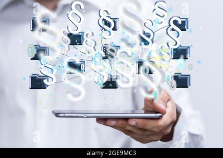 3D render of floating paragraph law and justice symbols over a hand holding a phone Stock Photo