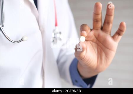 doctor holding medical pill on palm of hand  Stock Photo