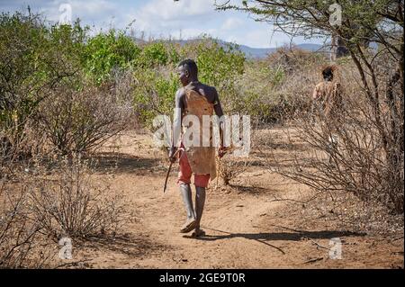 hunting bushmen of Hadzabe  tribe with bow and arrow, Lake Eyasi, Tanzania, Africa Stock Photo