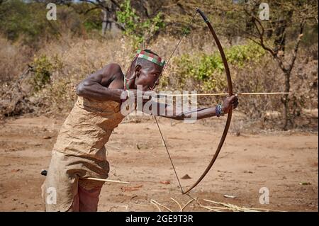 bushmen of Hadzabe  tribe train the hunt with bow and arrow, Lake Eyasi, Tanzania, Africa Stock Photo