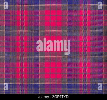 Abstract background - traditional Scottish fabric in a cage. Green stripes on a red background. Stock Photo