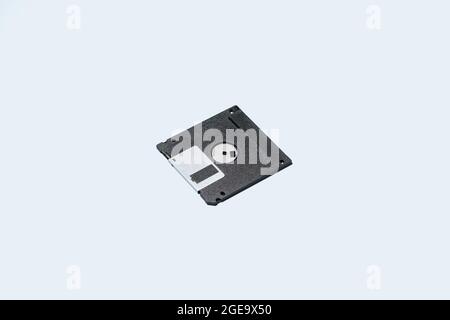 From above black floppy disks placed on light blue background Stock Photo