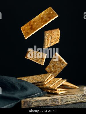 Creative concept with falling food on black backdrop Stock Photo