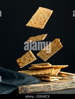 Creative concept with falling food on black backdrop Stock Photo