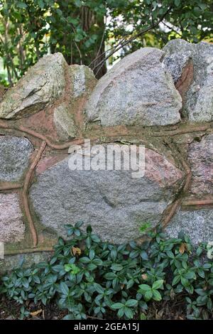 An old stone wall with big boulders. Stock Photo