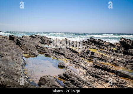 Rocks on the beach in Zambujeira Do Mar, Vicentina Coast Natural Park, Alentejo, Portugal Stock Photo