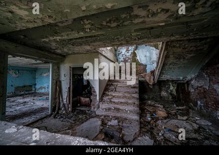 The interior of an abandoned Soviet-era factory in Sukhum in Abkhazia. Stock Photo