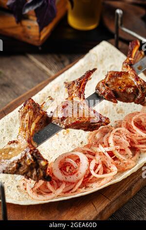 Grilled georgian lamb ribs shashlik skewers Stock Photo