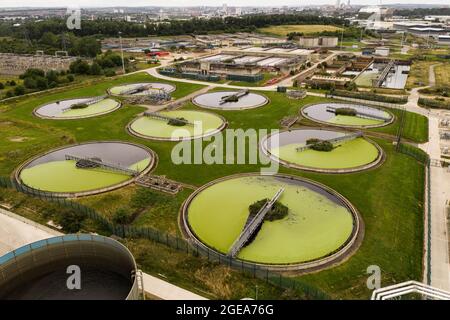 Aerial view of the tanks of a UK sewage and water treatment plant enabling the discharge and re-use of waste water