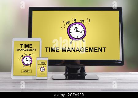 Time management concept shown on different information technology devices Stock Photo