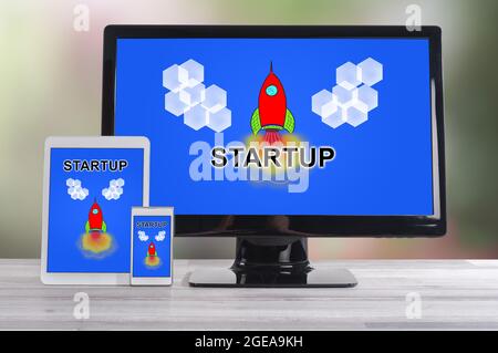 Start up concept shown on different information technology devices Stock Photo
