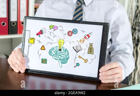 Business idea concept shown by a businessman Stock Photo