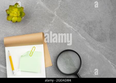 Open notepad on gray marble background Stock Photo