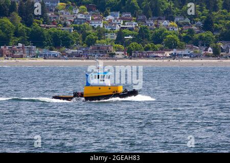 Tug West Point speeding across Elliot Bay near Seattle, Washington State, USA [Editorial licensing only] Stock Photo