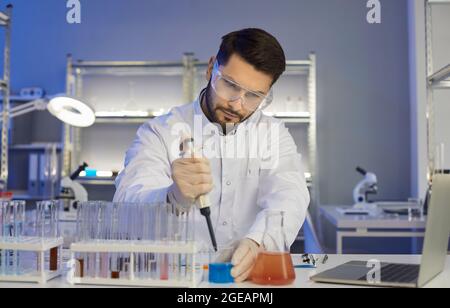 Serious medical scientist working in a pharma or biotech company scientific laboratory Stock Photo