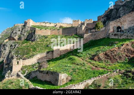 Looking up at the walls of Acrocorinth, The fortress was  continuously occupied from archaic times to the 19th  century. Corinth, Peloponnese, Greece. Stock Photo