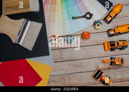 Home toy  and  Construction Vehicles on white paper. Stock Photo