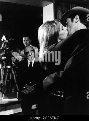 Director JEAN-PIERRE MELVILLE Camera Operator JEAN CHARVEIN NATHALIE DELON and ALAIN DELON on set candid filming LE SAMOURAI 1967 director JEAN-PIERRE MELVILLE novel The Ronin by Joan McLeod screenplay Jean-Pierre Melville and Georges Pellegrin cinematographer Henri Decae music Francois de Roubaix France-Italy co-production Compagnie Industrielle et Commerciale Cinematographique (CICC) / Fida Cinematografica / Filmel / T.C. Productions Stock Photo