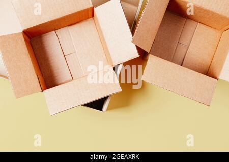 Empty open cardboard boxes on pastel background. Top view Stock Photo