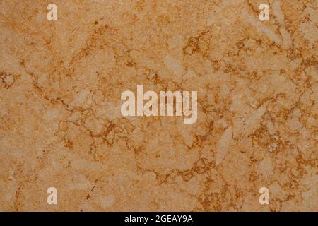 Golden marble surface with dark veining in random pattern Stock Photo