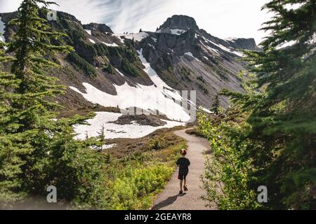 Young boy hiking at Heather Meadows in the Mt. Baker-Snoqualmie National Forest. Stock Photo