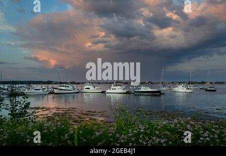 Rainclouds at sunset.  Dolphin Marina.  Harspwell, Maine.  Orr's Island in background. Stock Photo