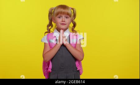 Pupil girl teenage sincerely praying to God and looking up with pleading expression, begging apology Stock Photo